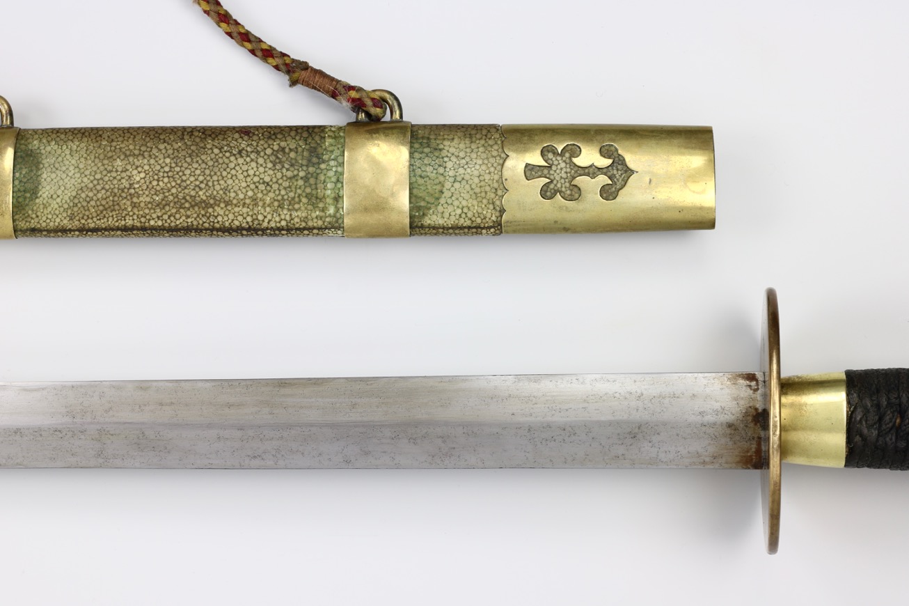 Antique Chinese straightsword with saber style guard.