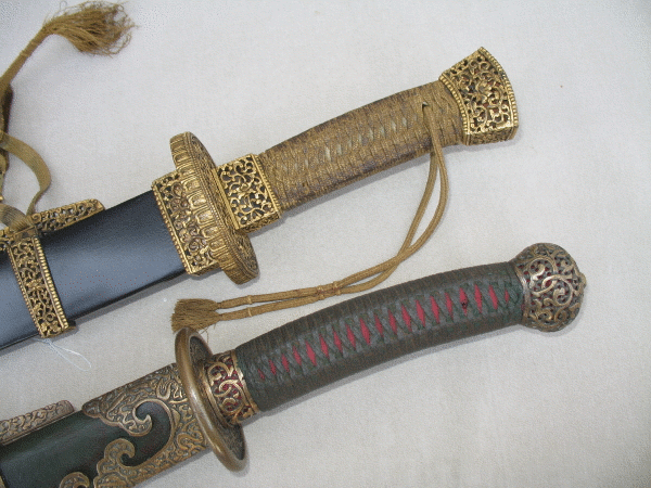 Two Qing saber hilts