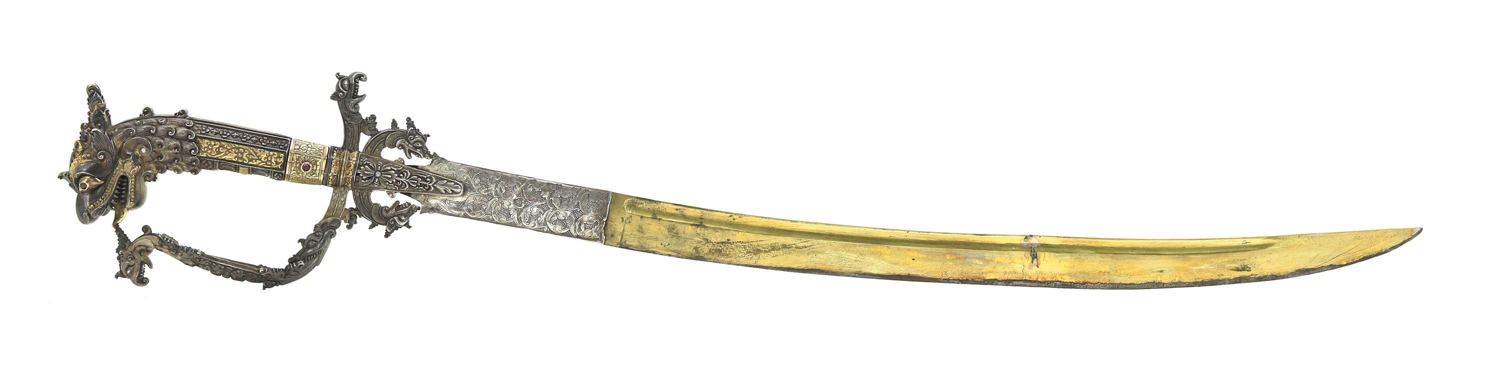Fine Sinhalese kasthane sword with parcel gilding and silver repousse scabbard