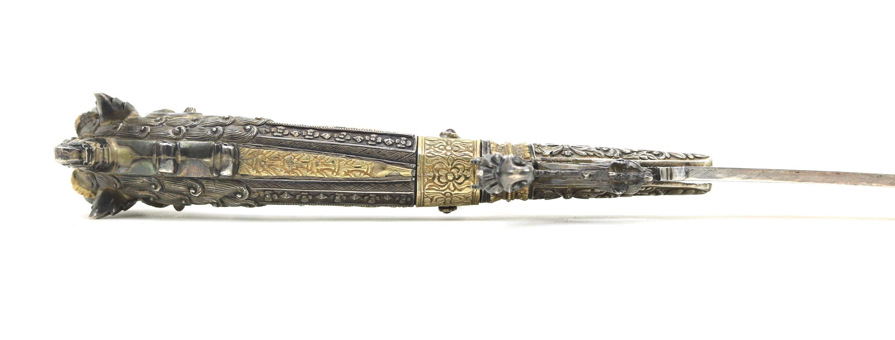 Fine Sinhalese kasthane sword with parcel gilding and silver repousse scabbard