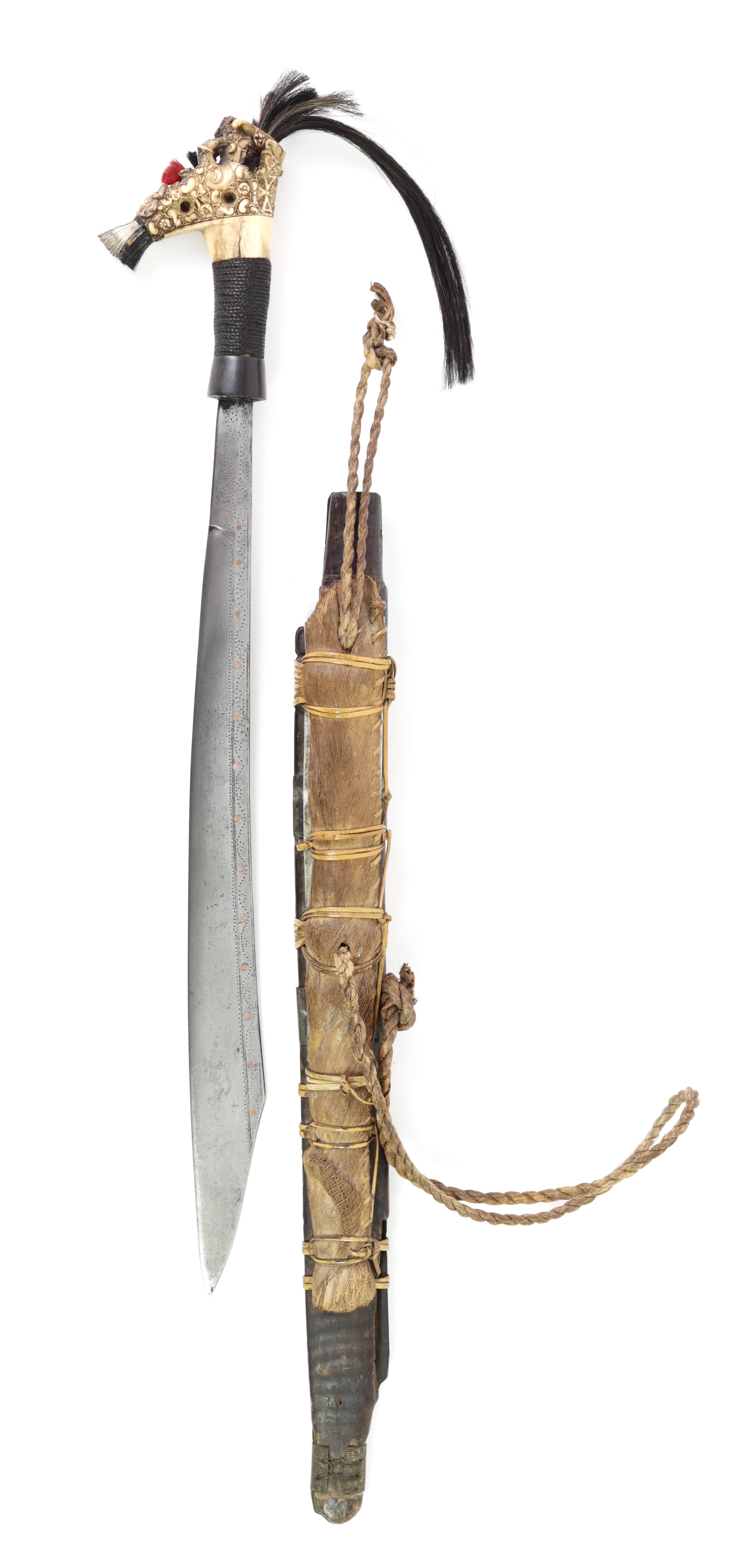 A fine Dayak headhunter sword with an exceptionally carved hilt.