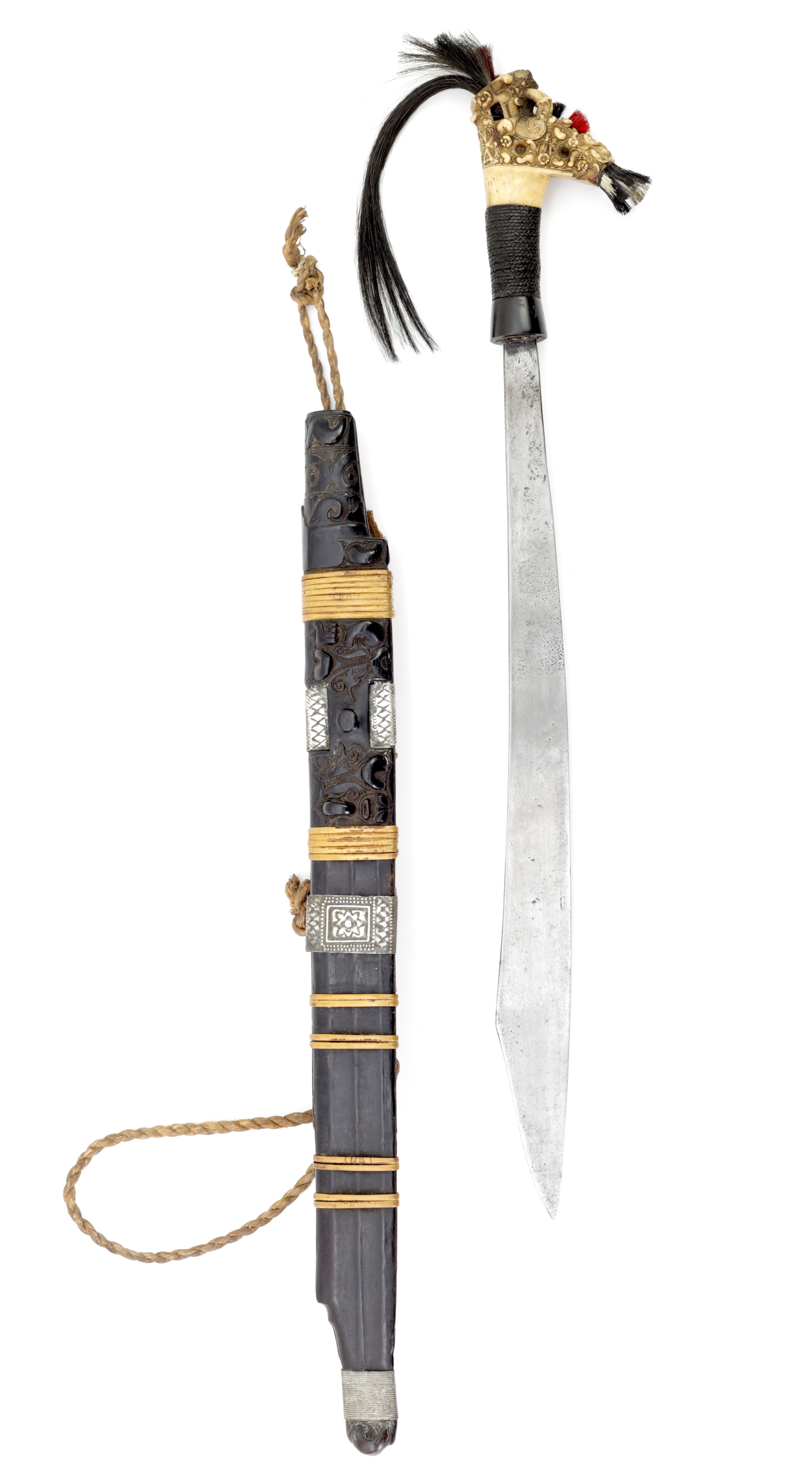 A fine Dayak headhunter sword with an exceptionally carved hilt.